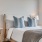 bedroom with ample space around the bed and bright lighting