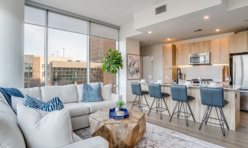 Open concept living area living and kitchen area with city views