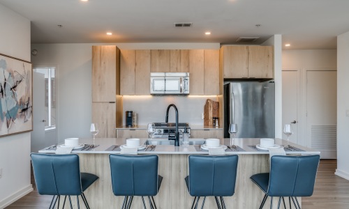 Kitchens with bar-style seating kitchen with ample counter-space and modern appliances