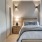bedroom with ample space around the bed and bright lighting