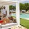 a group of people sitting on a lounge chair by a pool