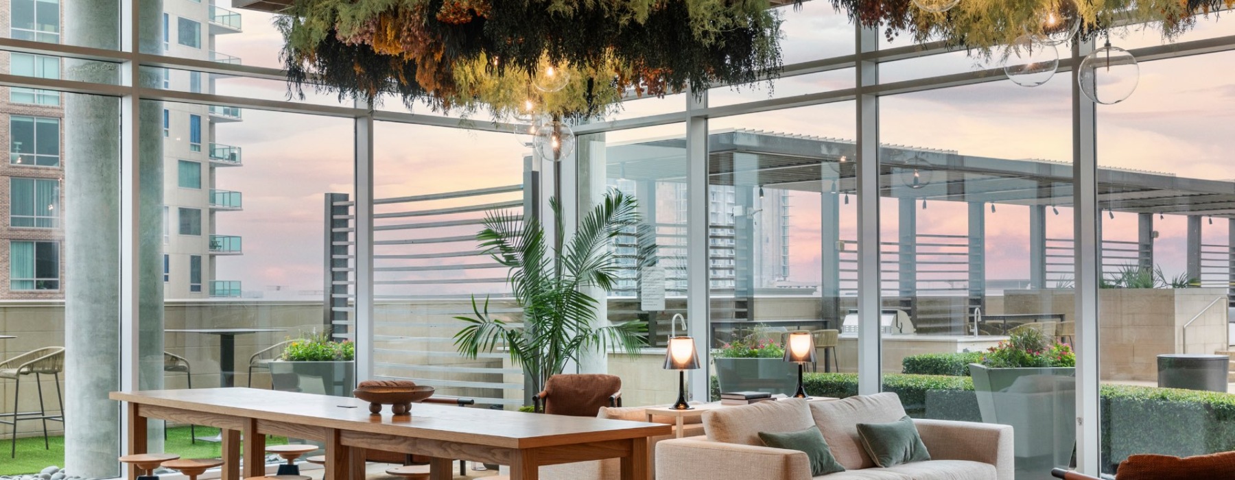 Upscale Lounge with Views of the Outdoor Kitchen at Our McKinney, Uptown Apartments in Dallas, TX
