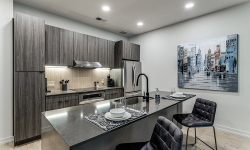 Designer Furnished Apartments ample counter space in a modern kitchen