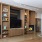 a room with a tv and shelves
