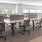 an empty office with a large table and chairs
