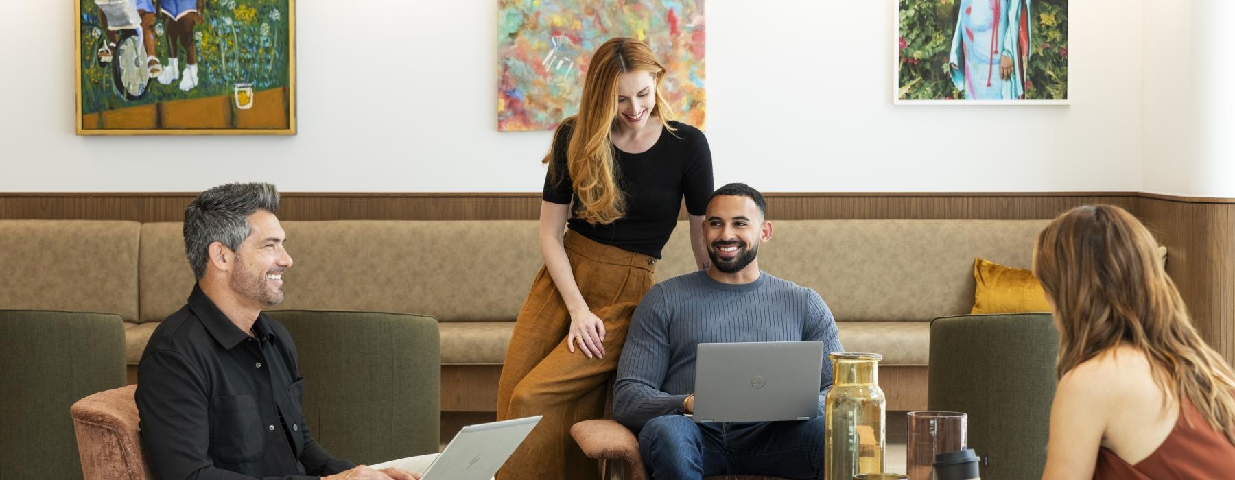 smiling people sitting in a bright room