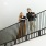 a man and woman standing on a staircase